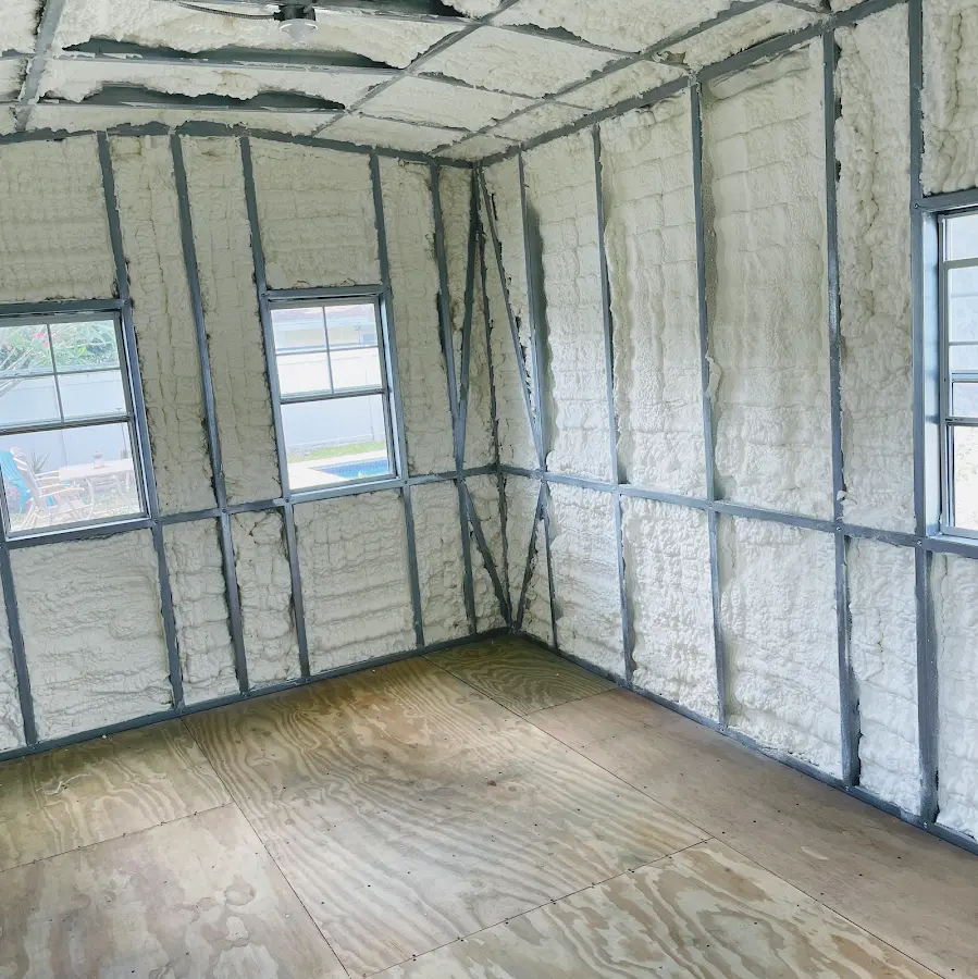 Closed-cell spray foam insulation applied to wall cavities in a residential project in Lumberton